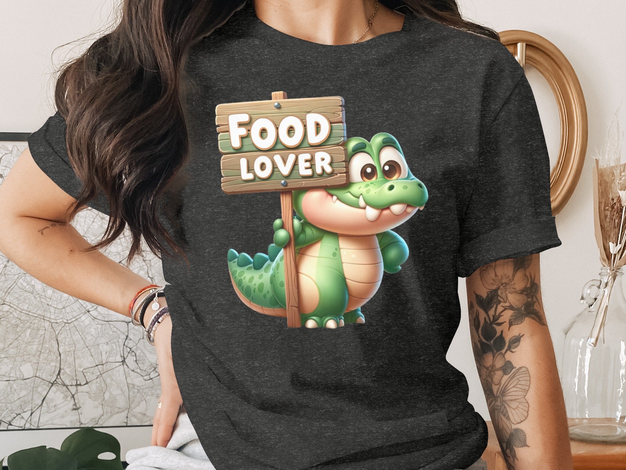 Cartoon alligator holding a sign that reads "FOOD LOVER".