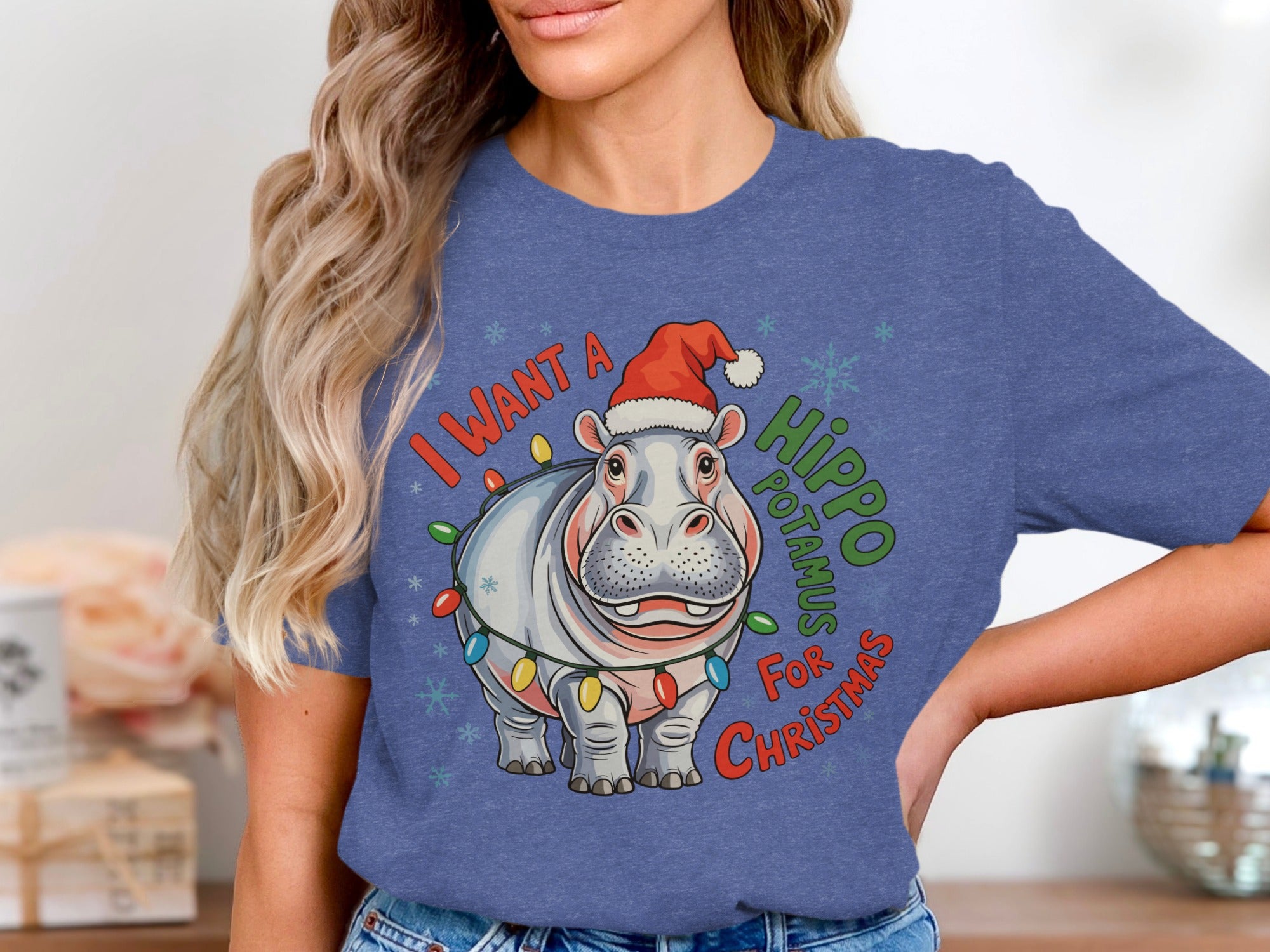 Hippopotamus wearing a Santa hat and Christmas lights, with text "I want a hippopotamus for Christmas".