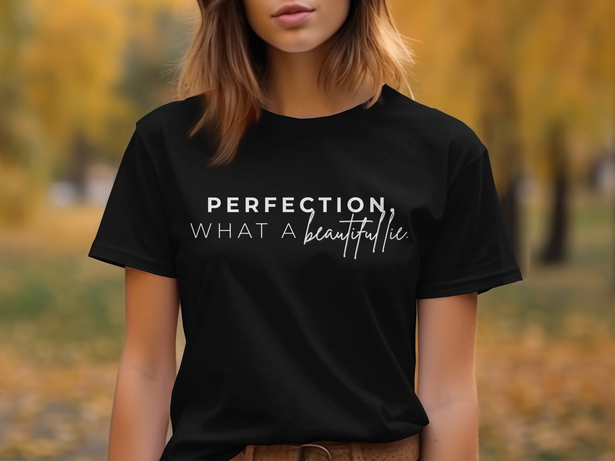 Black t-shirt with "PERFECTION, WHAT A beautiful lie" text in white.