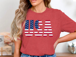 Red t-shirt with large "USA" graphic featuring American flag design.