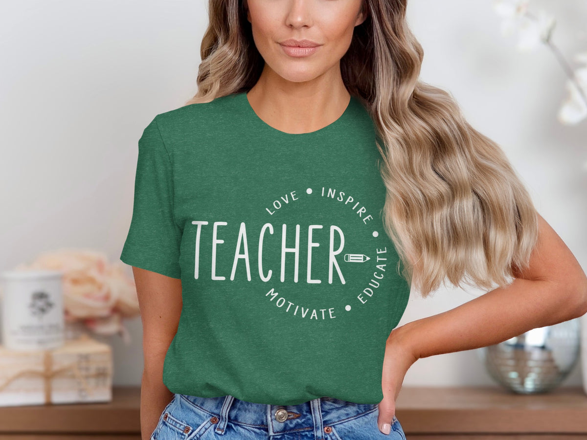 Green t-shirt with white text "TEACHER" and surrounding words "LOVE INSPIRE MOTIVATE EDUCATE".