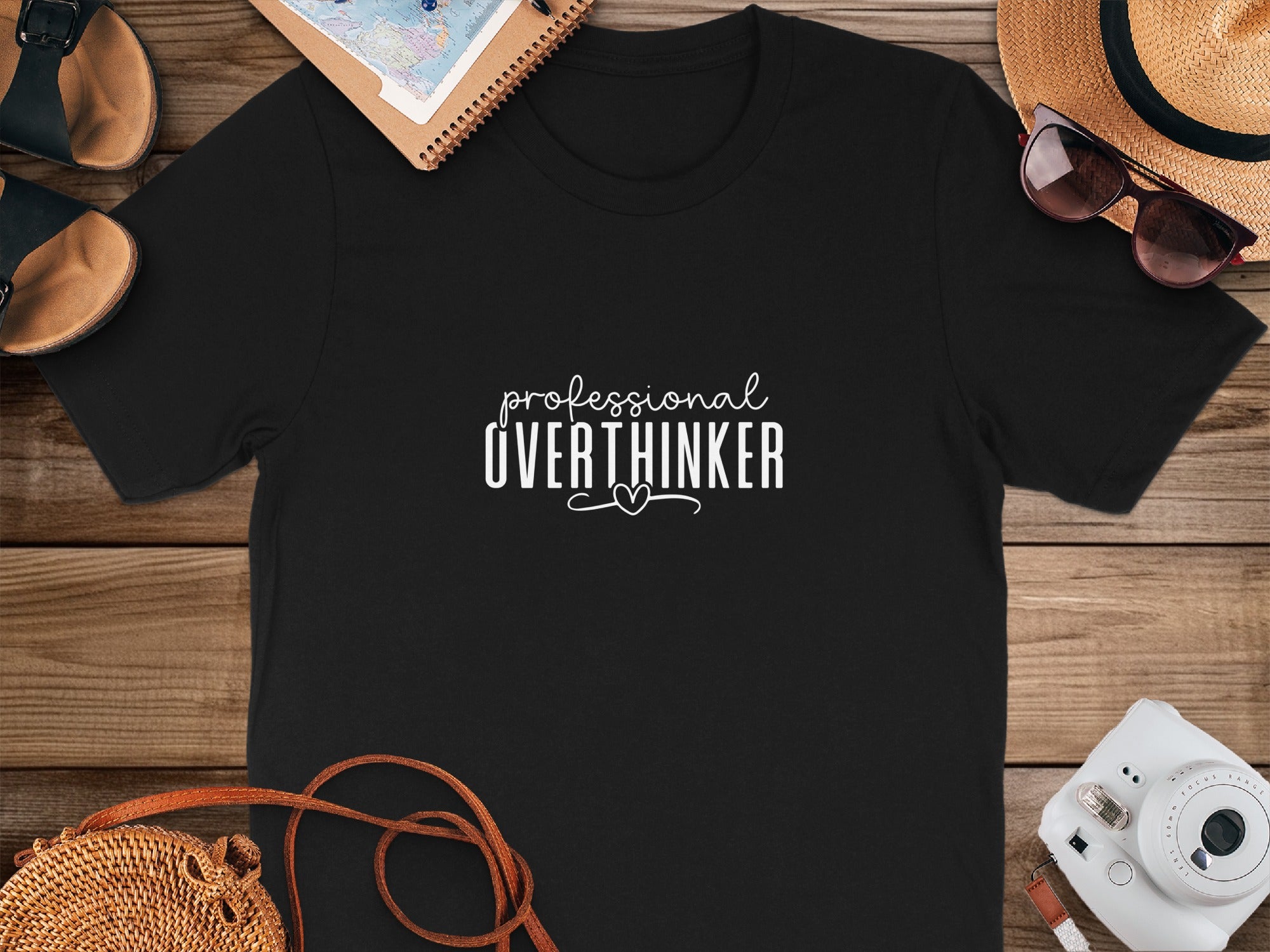 Black t-shirt with "professional OVERTHINKER" text and a heart.