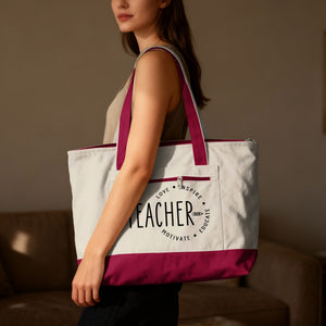 Cream tote bag with pink trim and "TEACHER" graphic with "LOVE INSPIRE MOTIVATE EDUCATE".
