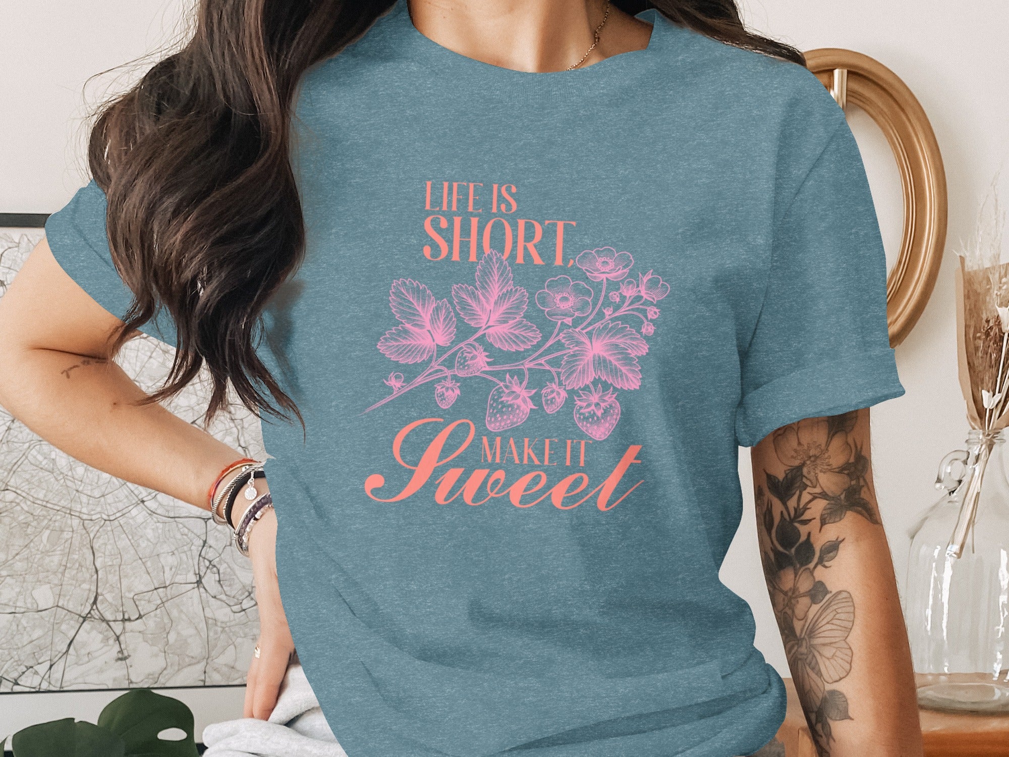 Teal t-shirt with pink text "Life is Short, Make it Sweet" and strawberry design.