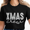 Black t-shirt with "XMAS crew" text in white distressed and script font.