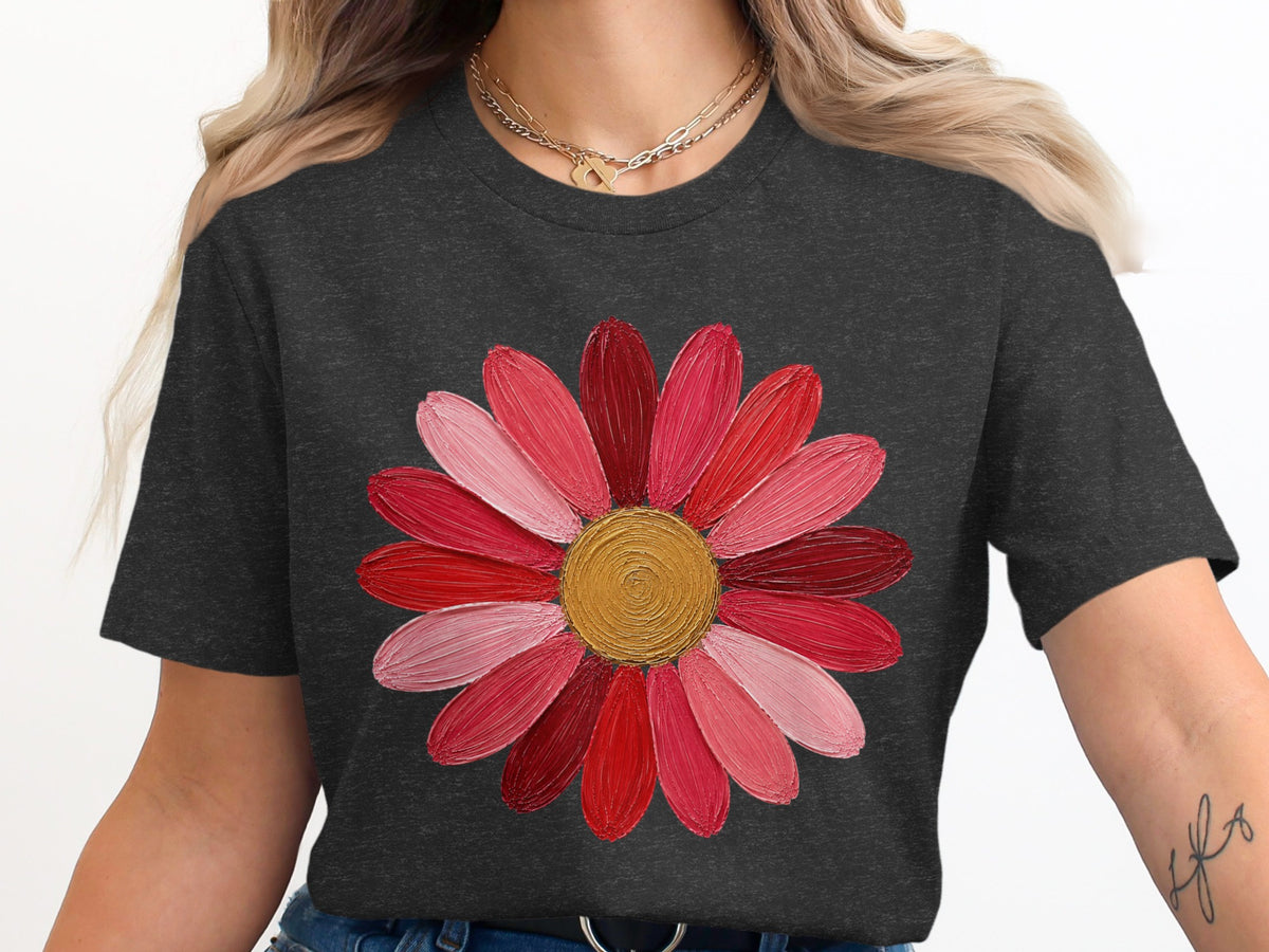 Dark grey t-shirt with a pink and red flower graphic and gold necklace.