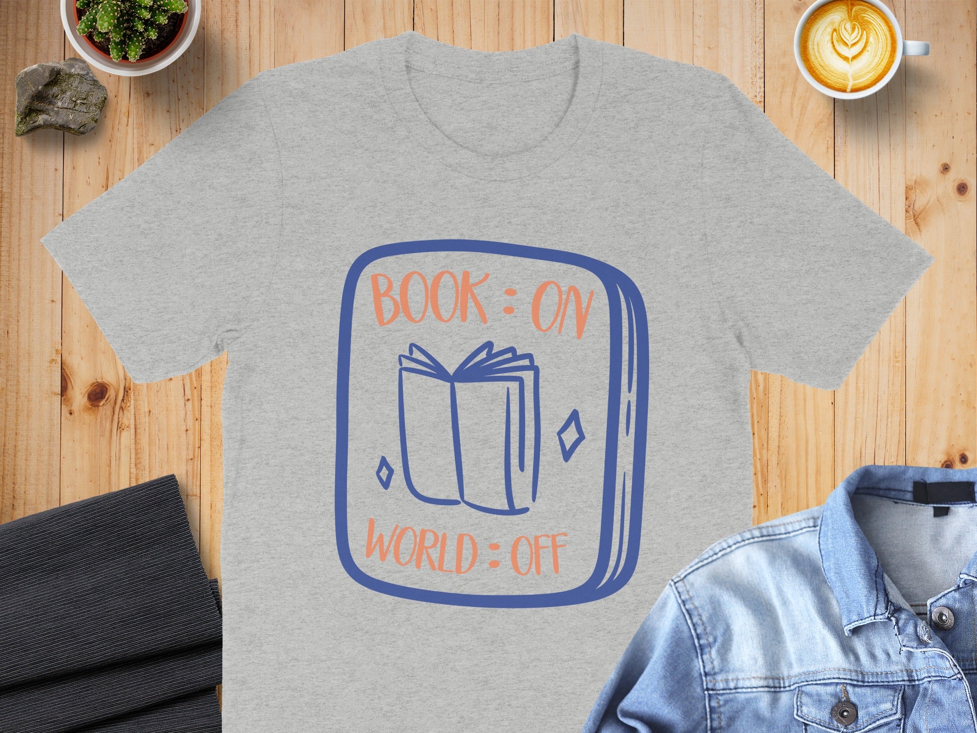 Grey t-shirt with "BOOK: ON WORLD: OFF" text and open book graphic.