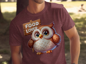 Cute owl with a wooden sign that says "FOOD LOVER" on a maroon t-shirt.