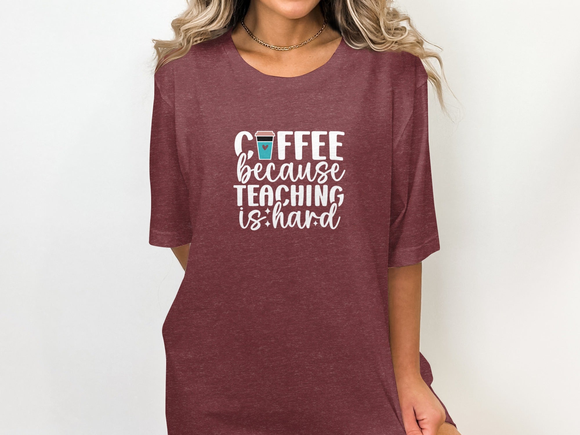 Maroon graphic t-shirt with white text "Coffee because teaching is hard".
