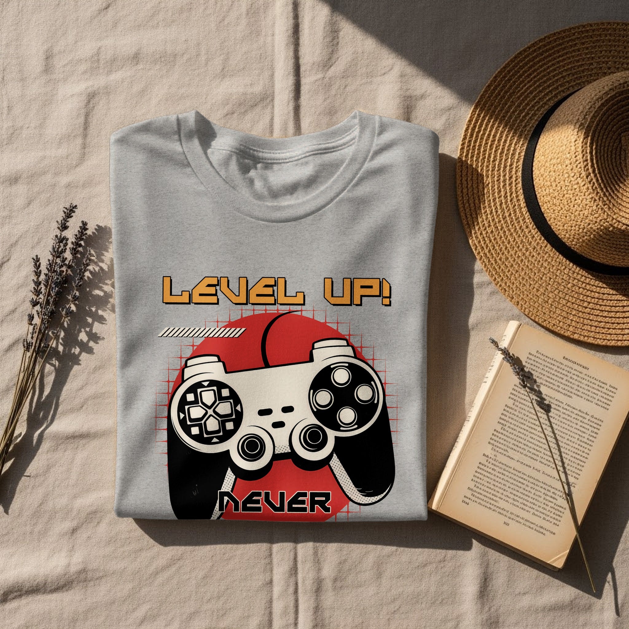 Grey t-shirt with "Level Up! Never" text and vintage video game controller graphic.