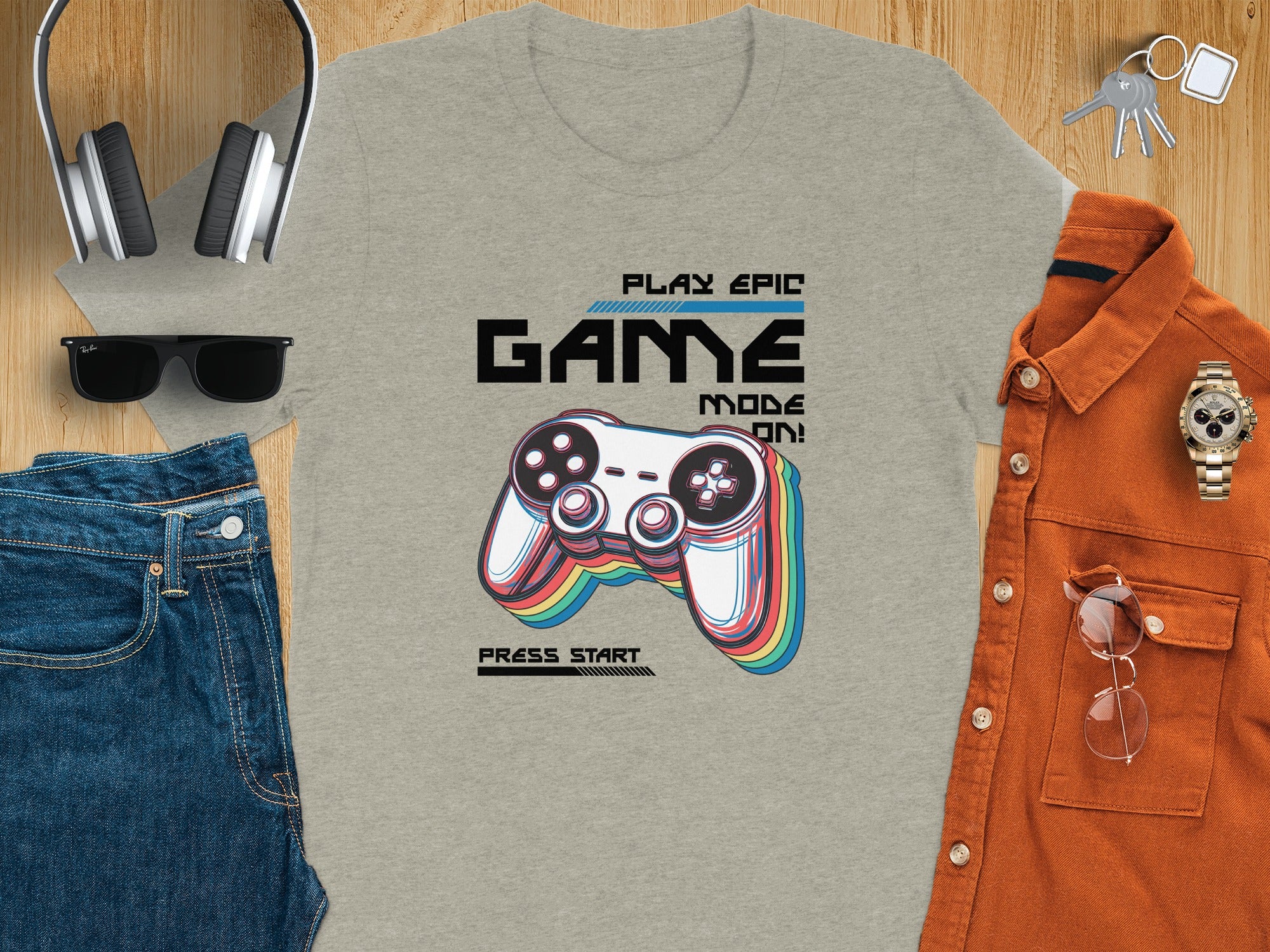 Grey t-shirt with "PLAY EPIC GAME MODE ON!" and a video game controller.