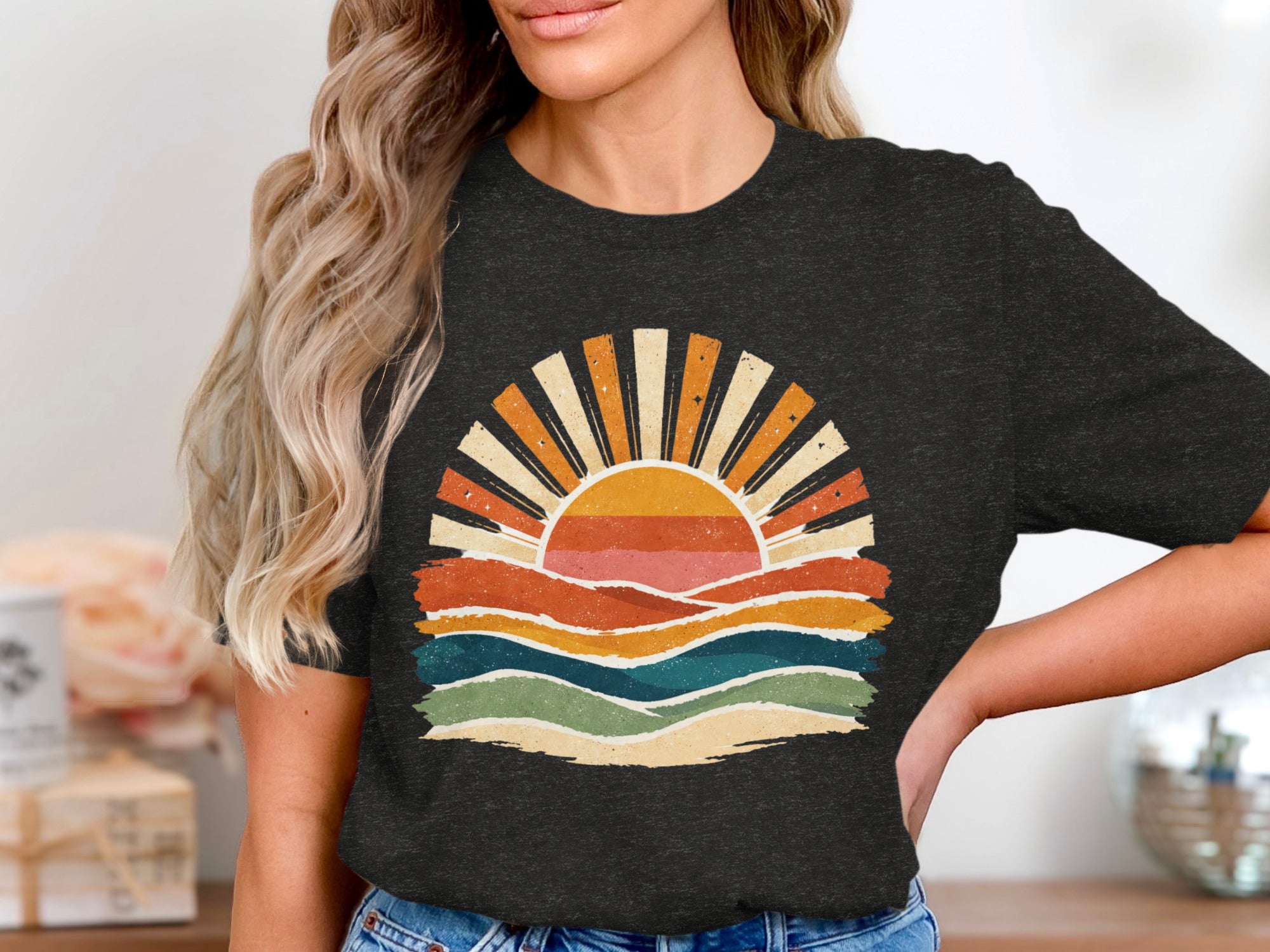 Dark t-shirt with vintage sunrise graphic featuring colorful waves and radiating sun.