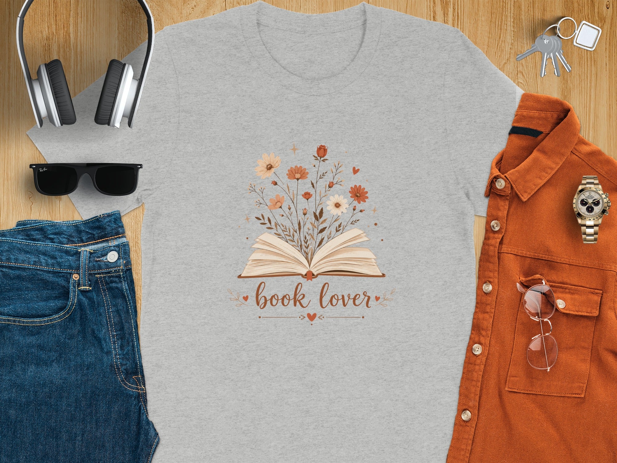 Gray t-shirt with open book and flowers artwork, says "book lover."