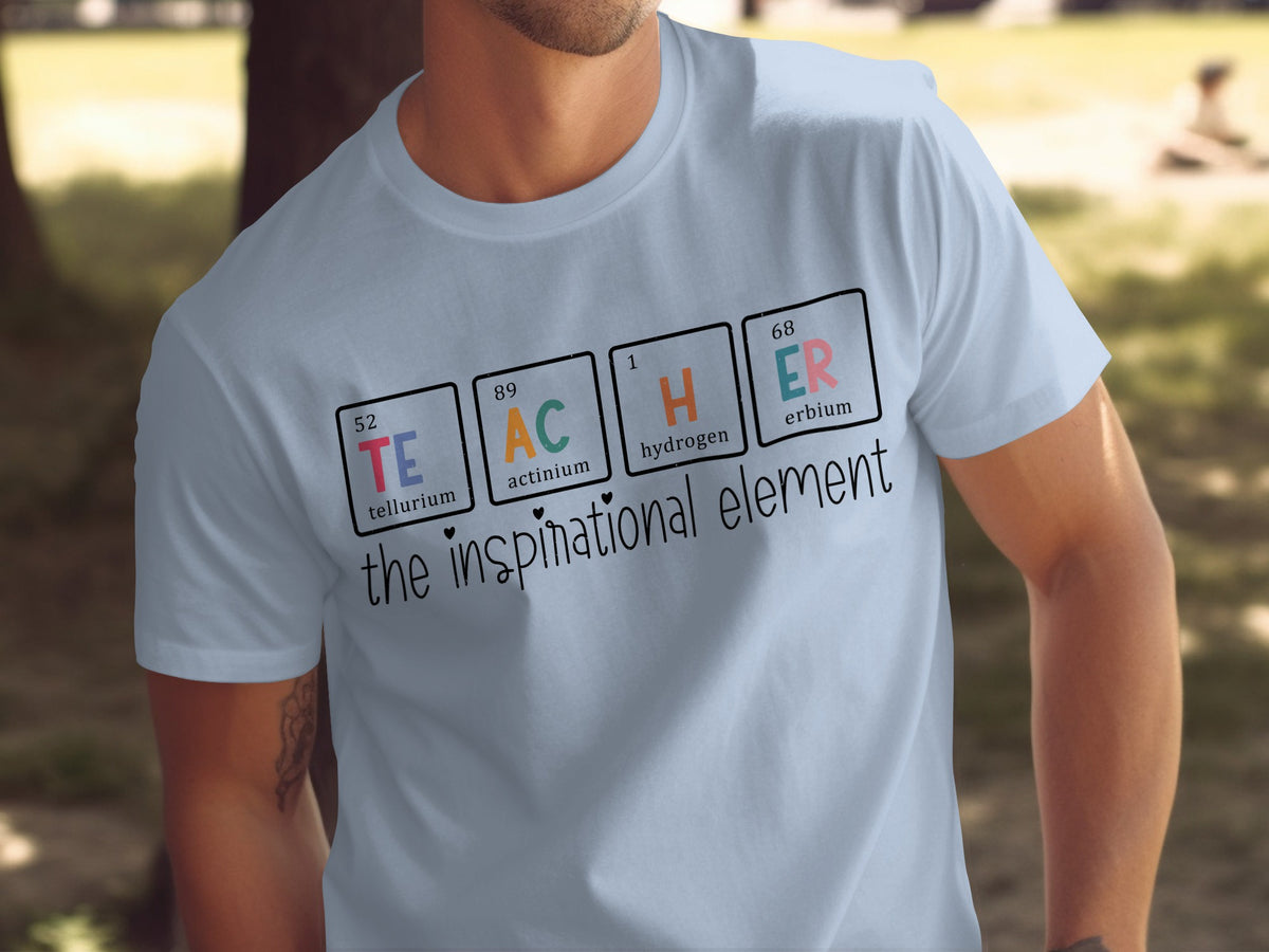 Light blue t-shirt with periodic table elements spelling TEACHER and "the inspirational element".