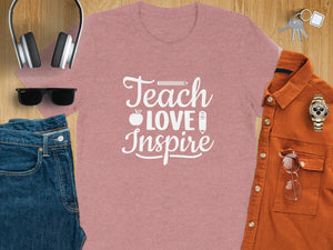Pink t-shirt with white text "Teach Love Inspire", apple, and pencil.