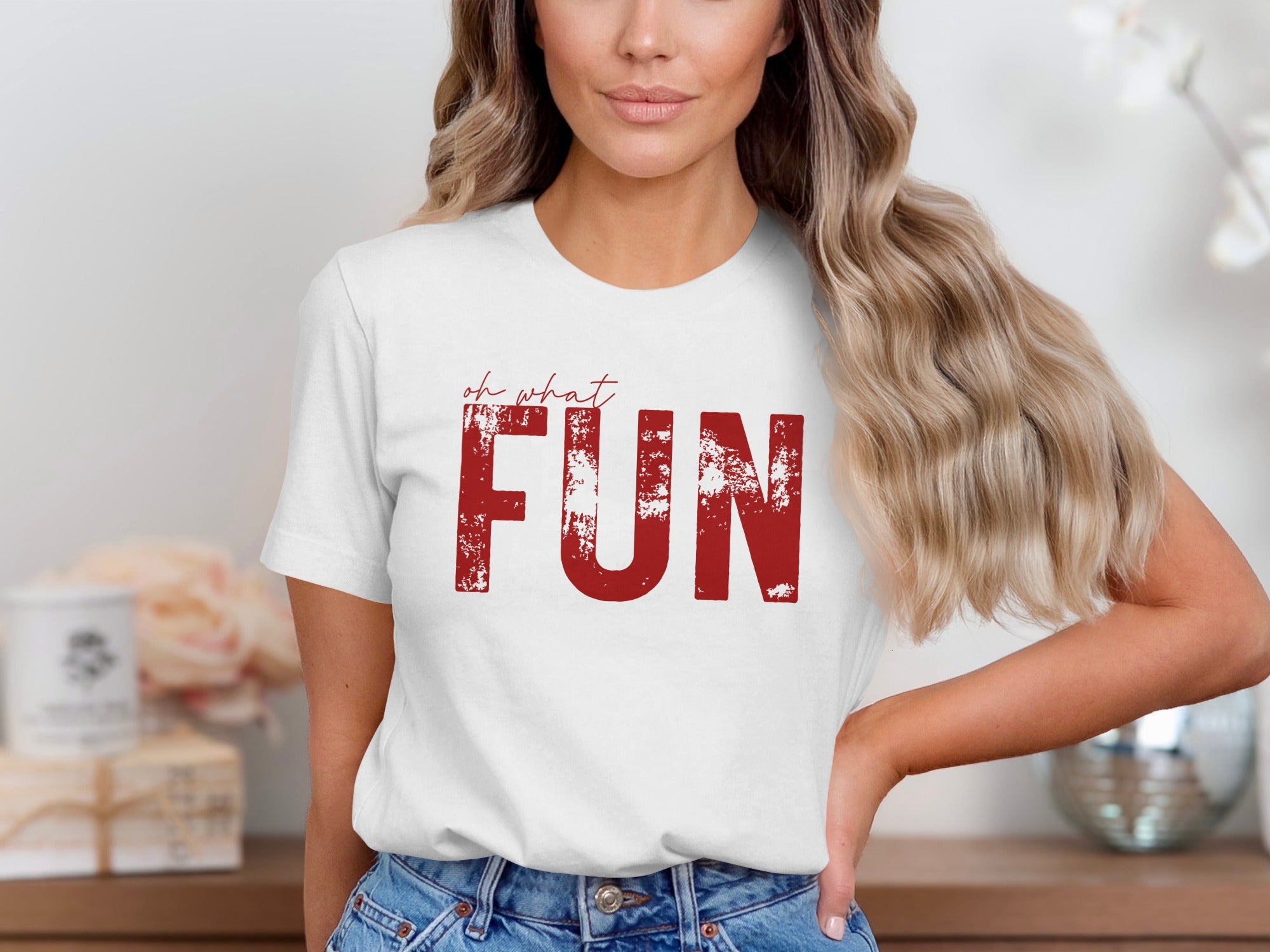 White t-shirt with red distressed text that reads "oh what FUN".