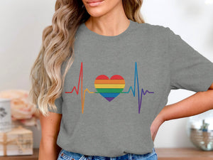 Grey t-shirt with rainbow heartbeat and heart graphic.