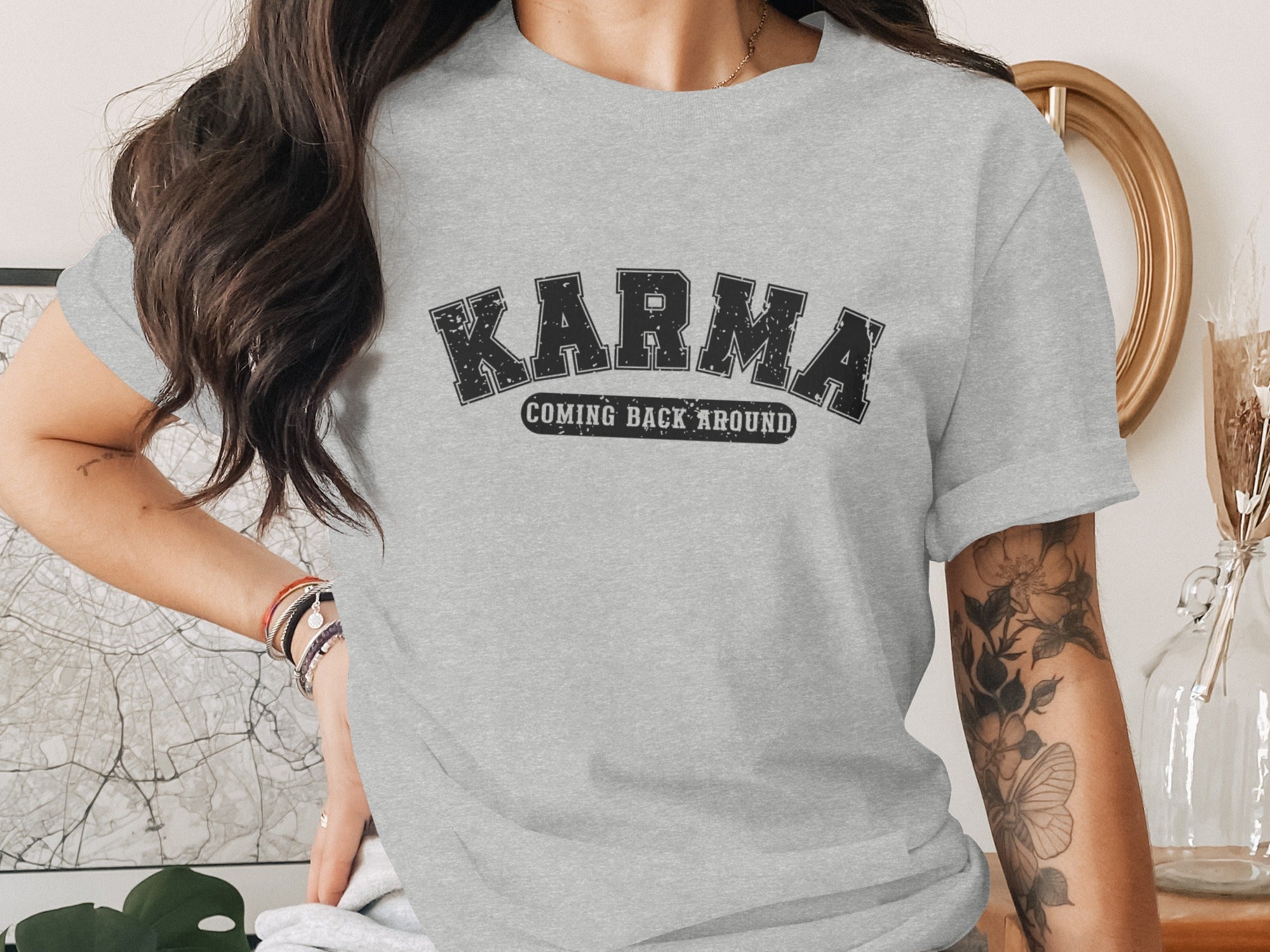 Grey t-shirt with "Karma Coming Back Around" graphic.