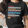 Black t-shirt with colorful text listing "Things We Did" and "Things We Didn't Do."