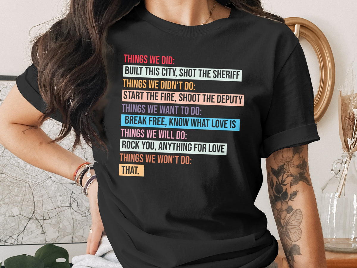 Black t-shirt with colorful text listing "Things We Did" and "Things We Didn't Do."