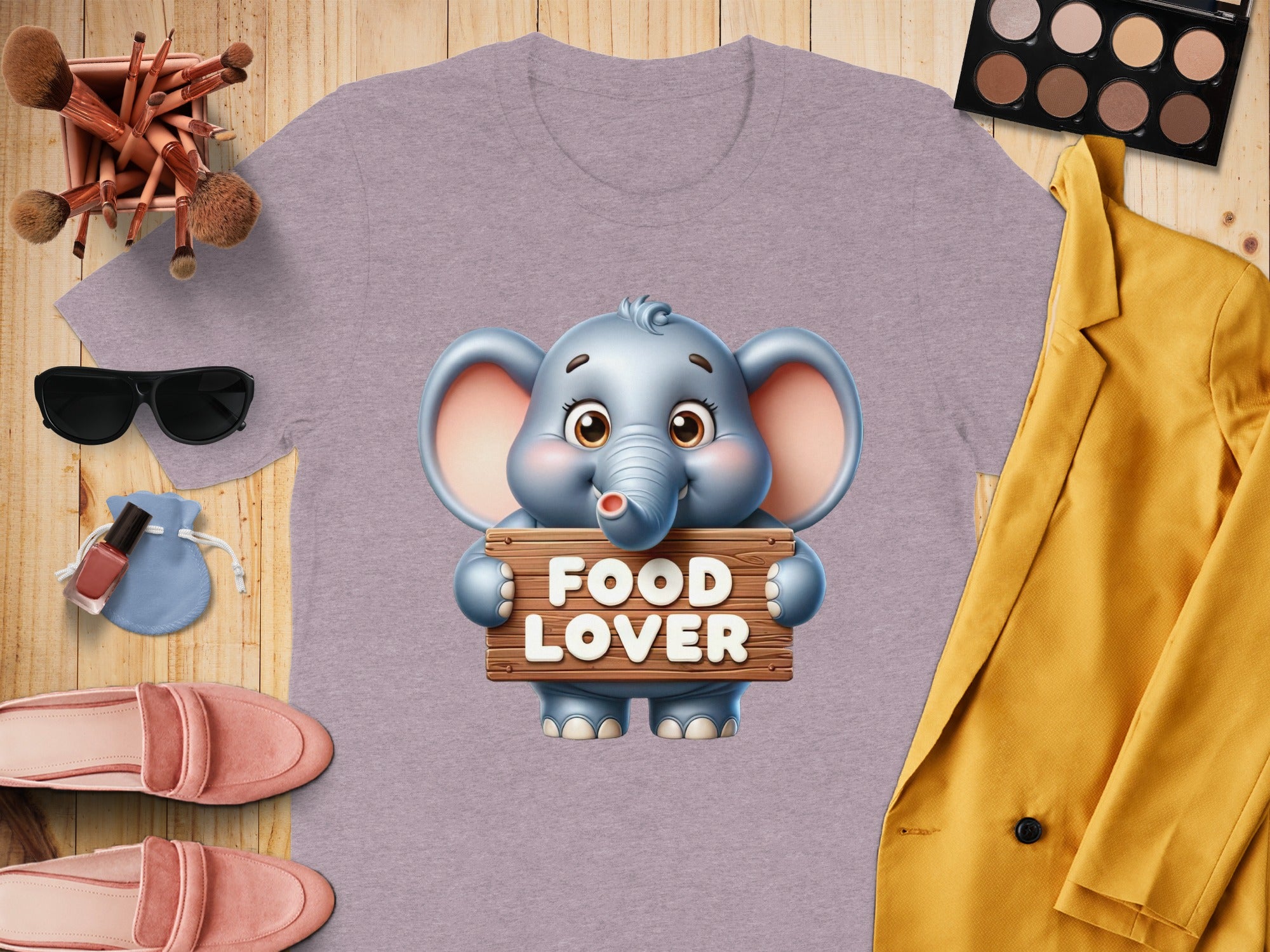 Lilac t-shirt with a cartoon elephant holding a "Food Lover" sign.