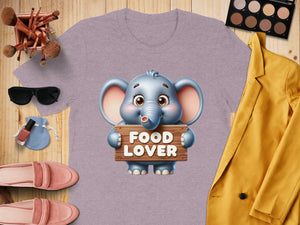 Lilac t-shirt with a cartoon elephant holding a "Food Lover" sign.