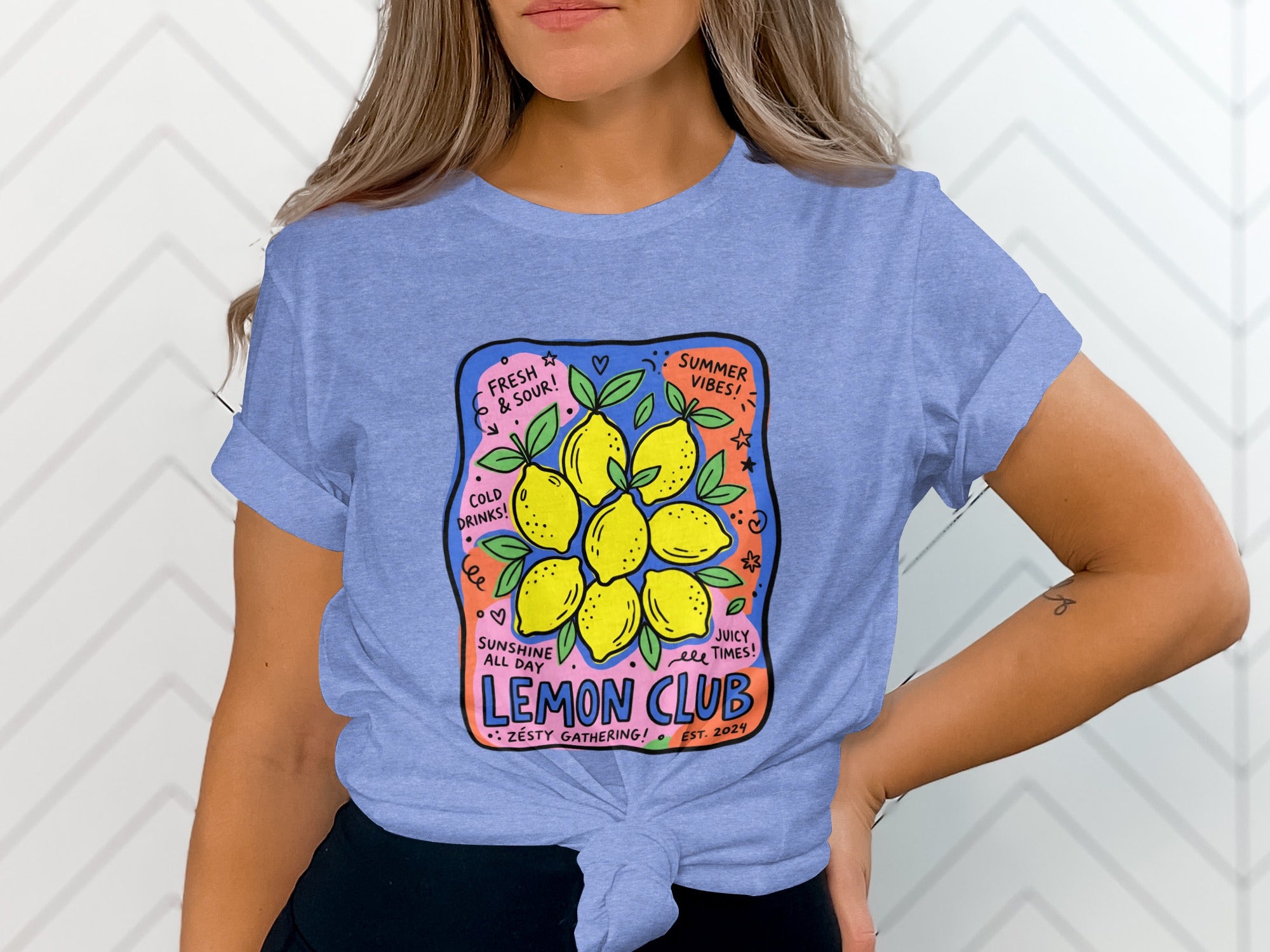Purple t-shirt with a graphic saying "LEMON CLUB" and images of lemons.