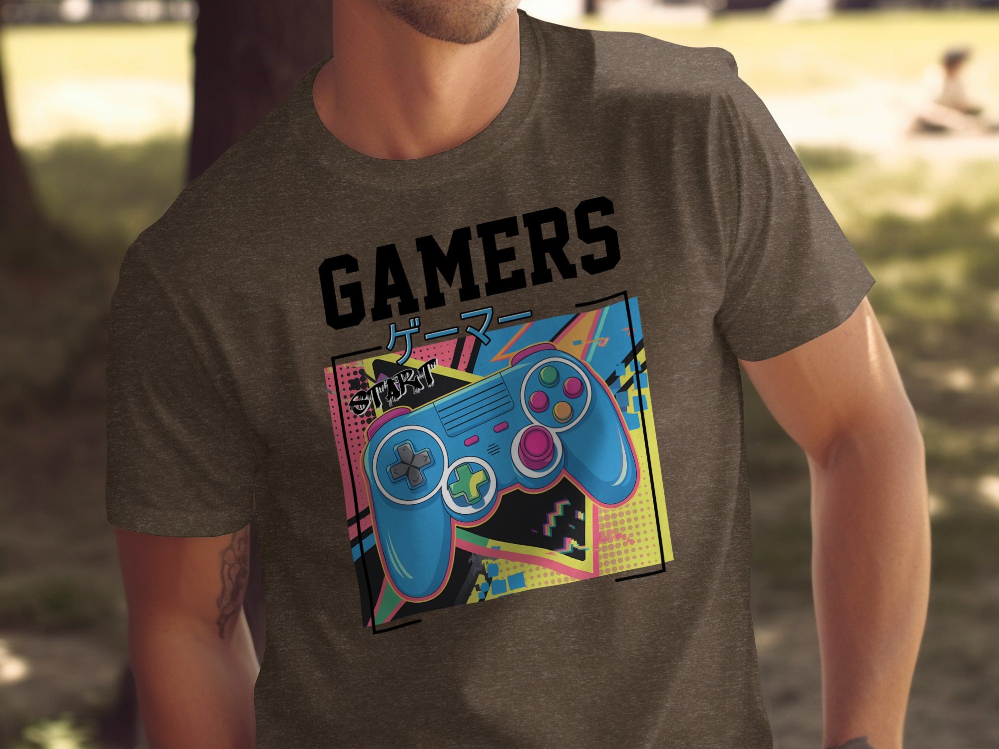 Brown t-shirt with graphic of blue video game controller and "GAMERS" text.