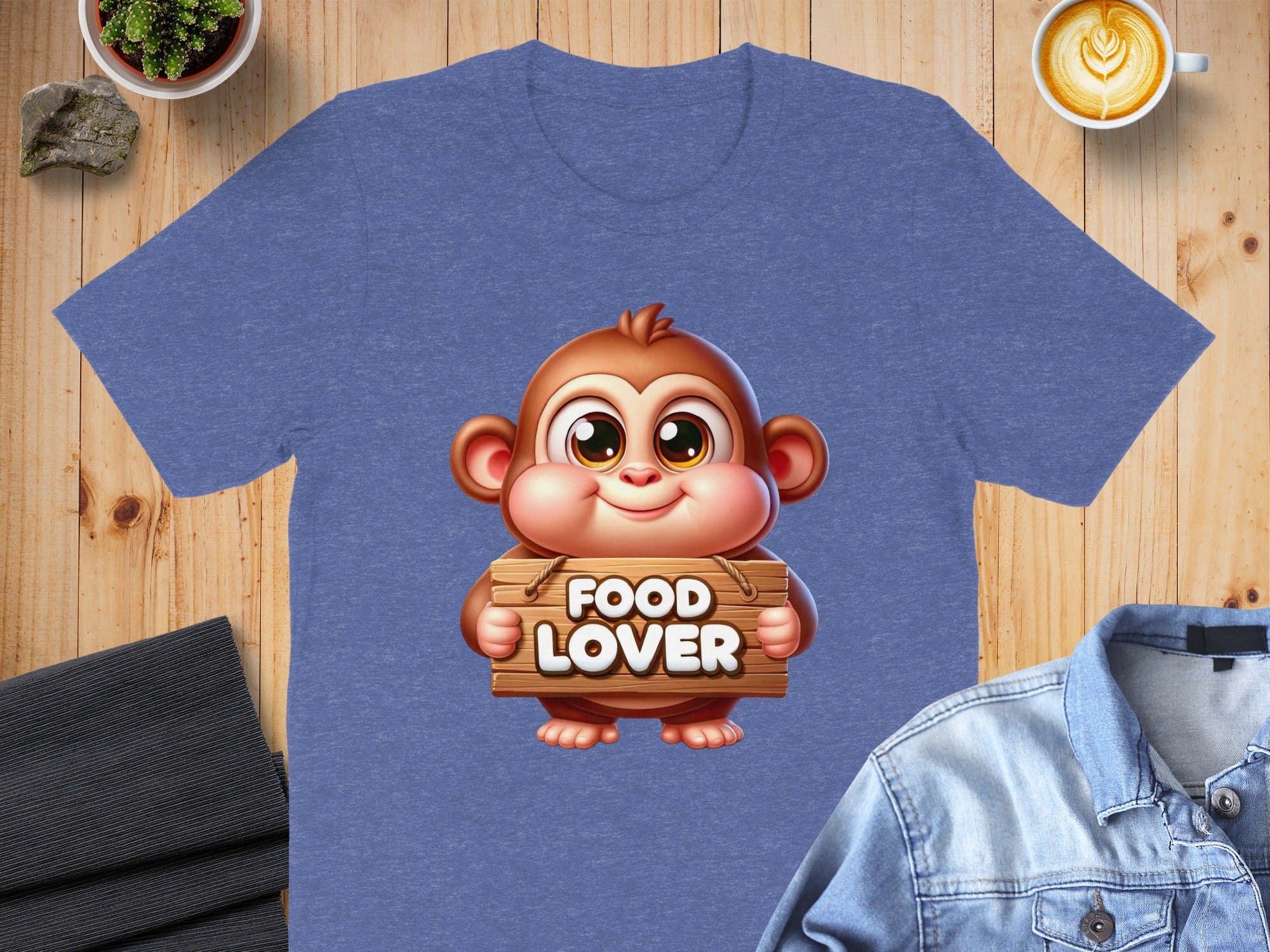 Blue t-shirt with cartoon monkey holding "FOOD LOVER" sign.