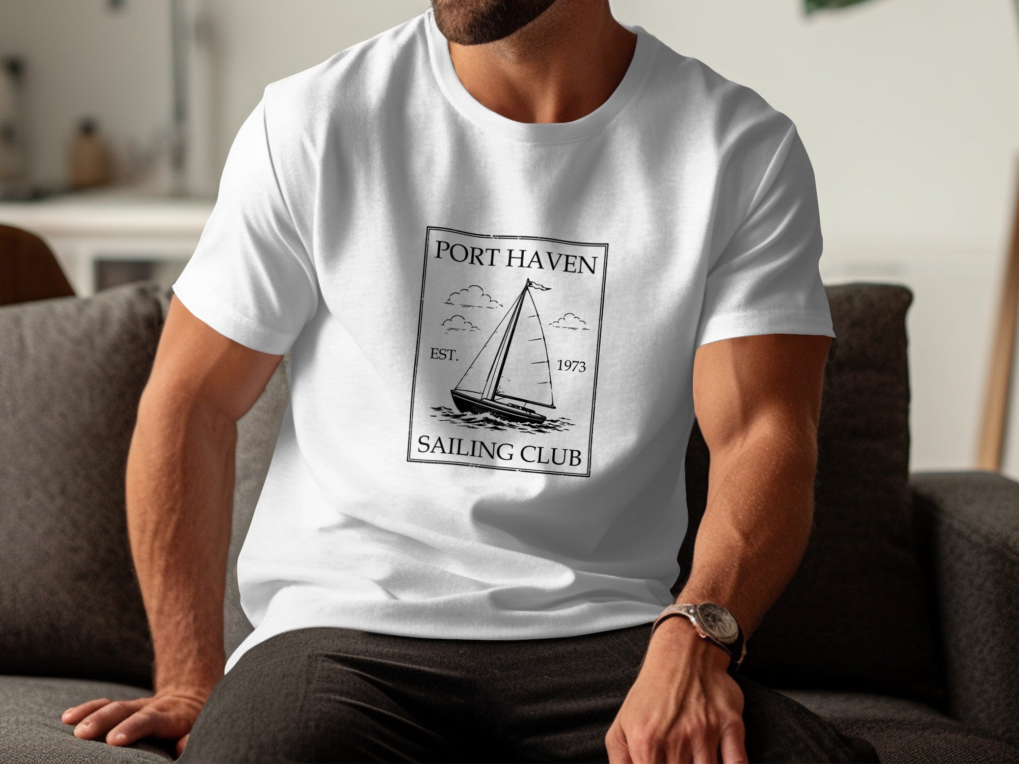 White t-shirt with "Port Haven Sailing Club Est. 1973" text and sailboat graphic.