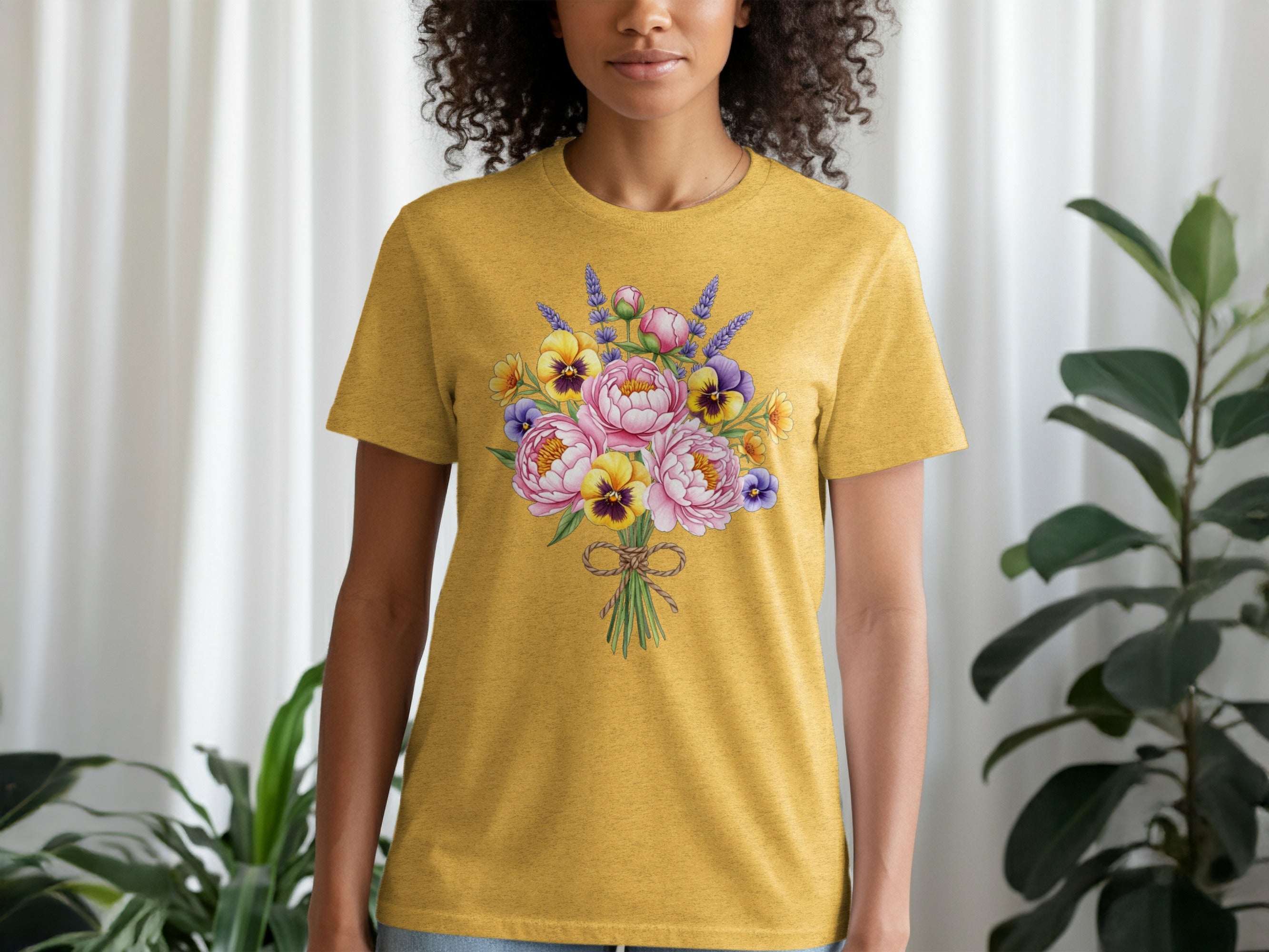 Yellow t-shirt with colorful floral bouquet graphic on the front.