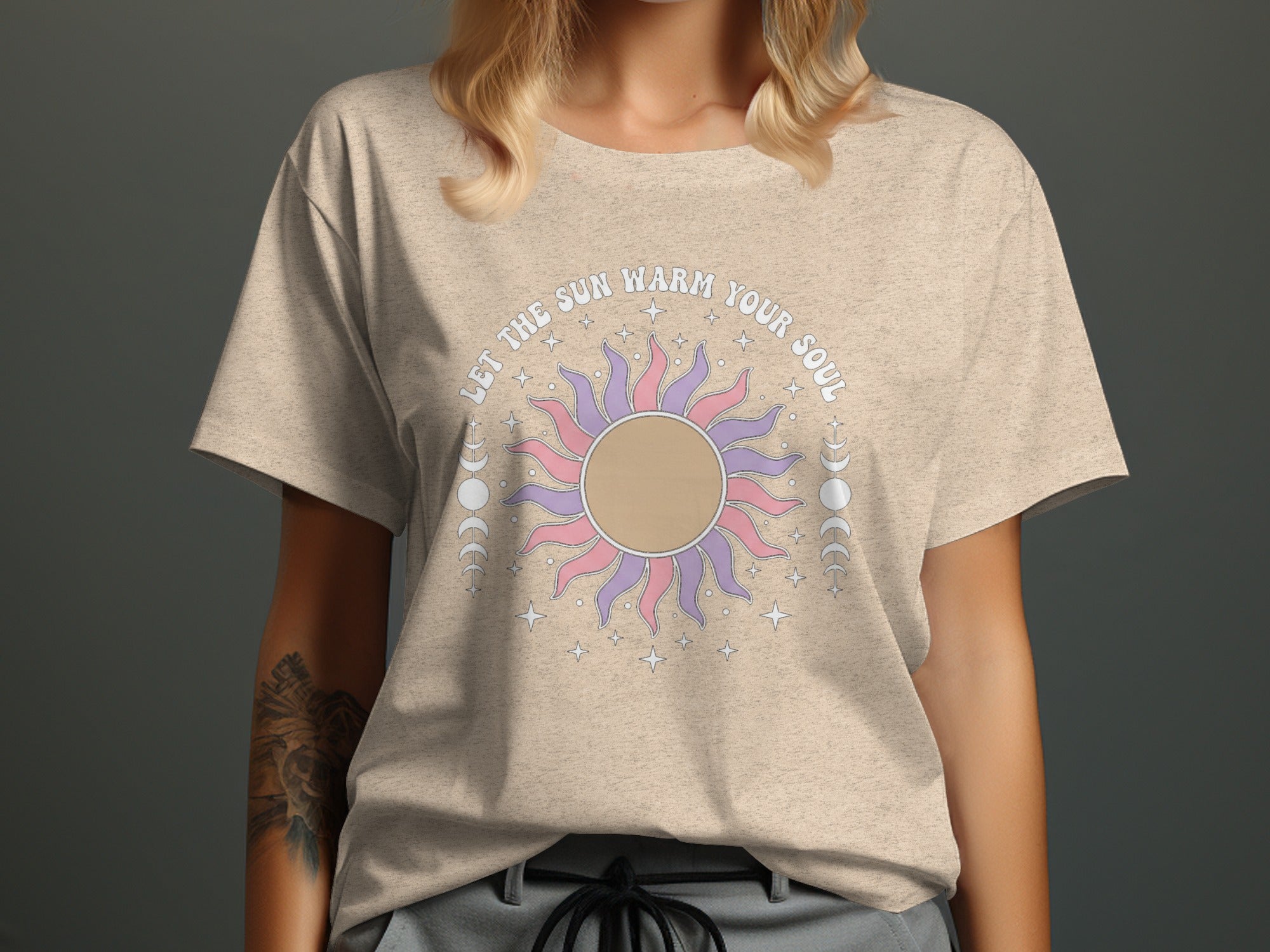 T-shirt with a sun graphic and text "LET THE SUN WARM YOUR SOUL"