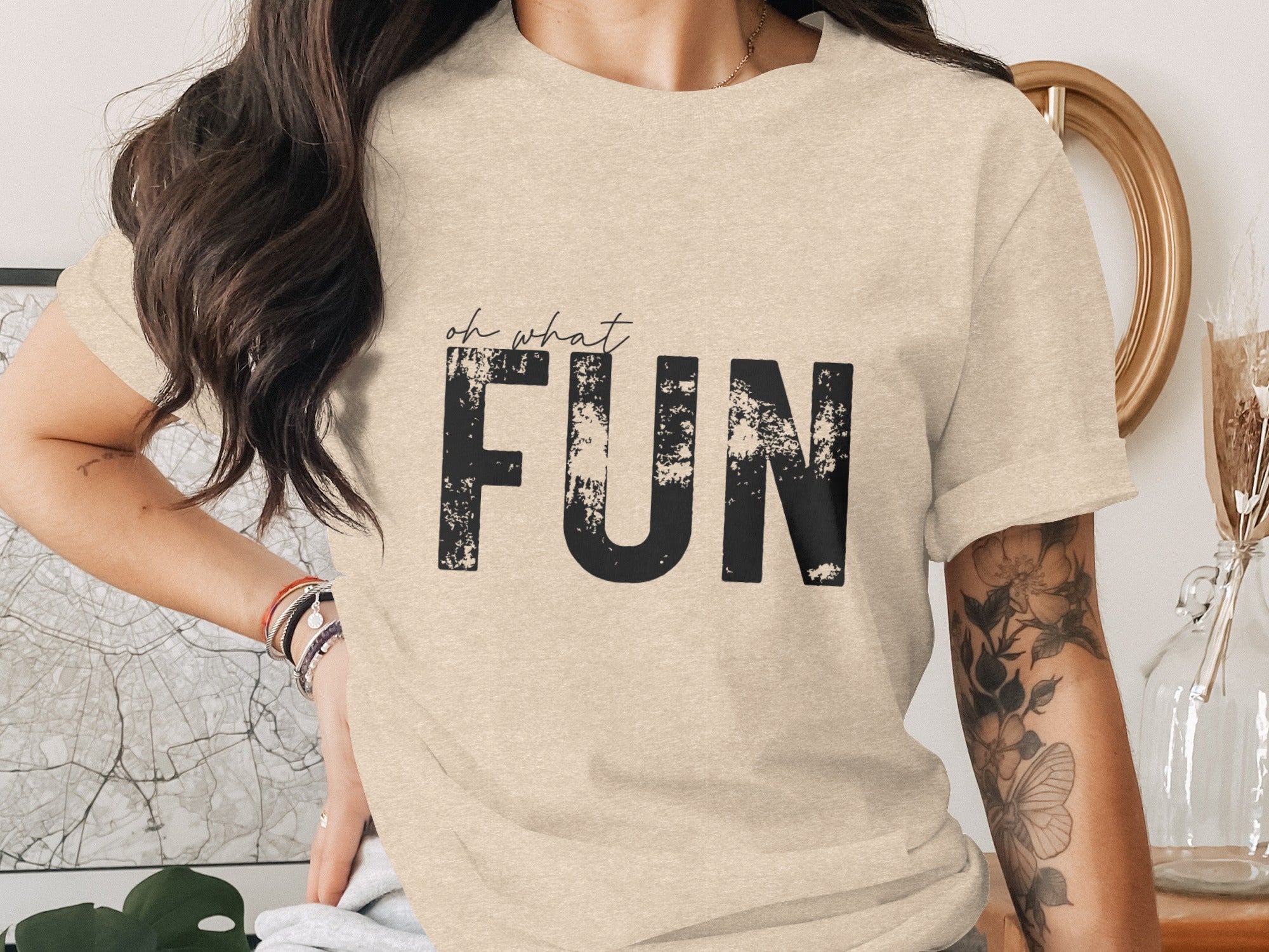 Light beige t-shirt with black distressed text "oh what FUN"