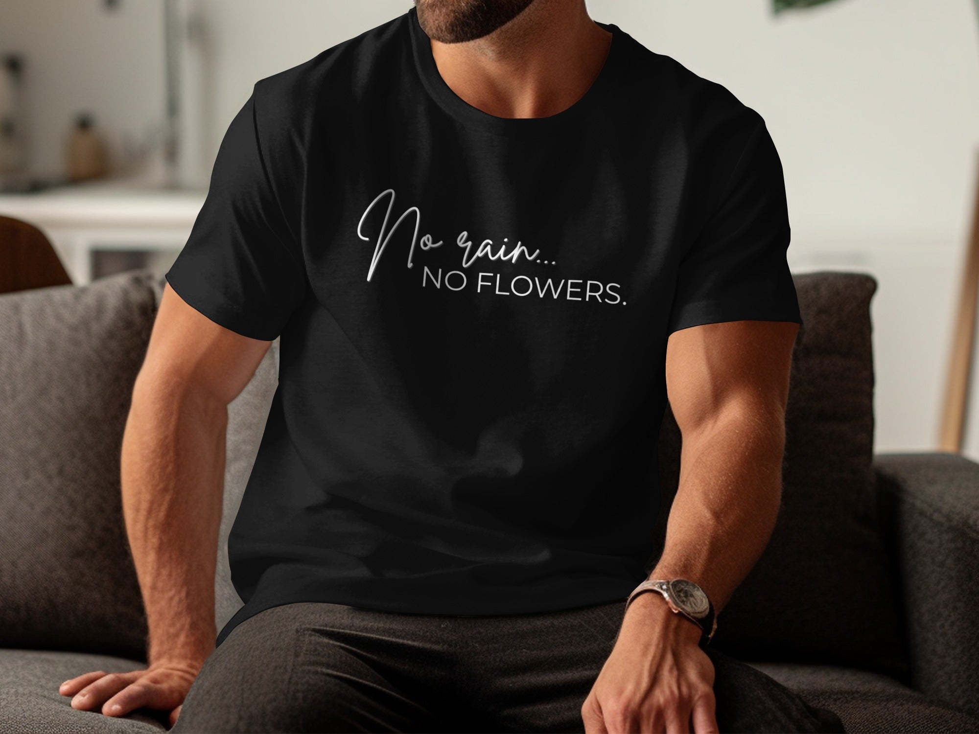 Black t-shirt with white text "No rain... NO FLOWERS."