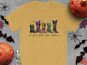 Yellow t-shirt with illustrated witch boots and text "A Girl's Gotta Have Options".