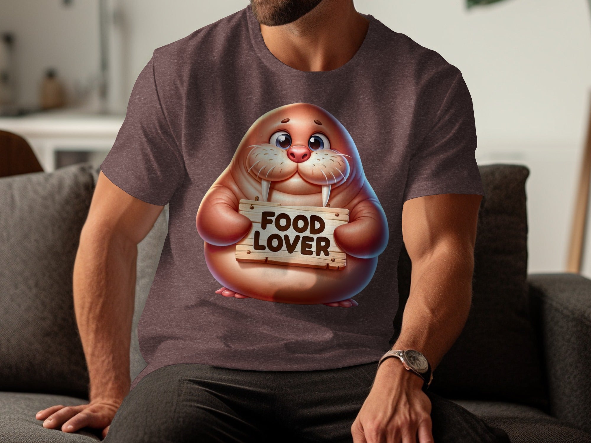 Cartoon walrus holding wooden sign that says FOOD LOVER on a t-shirt.