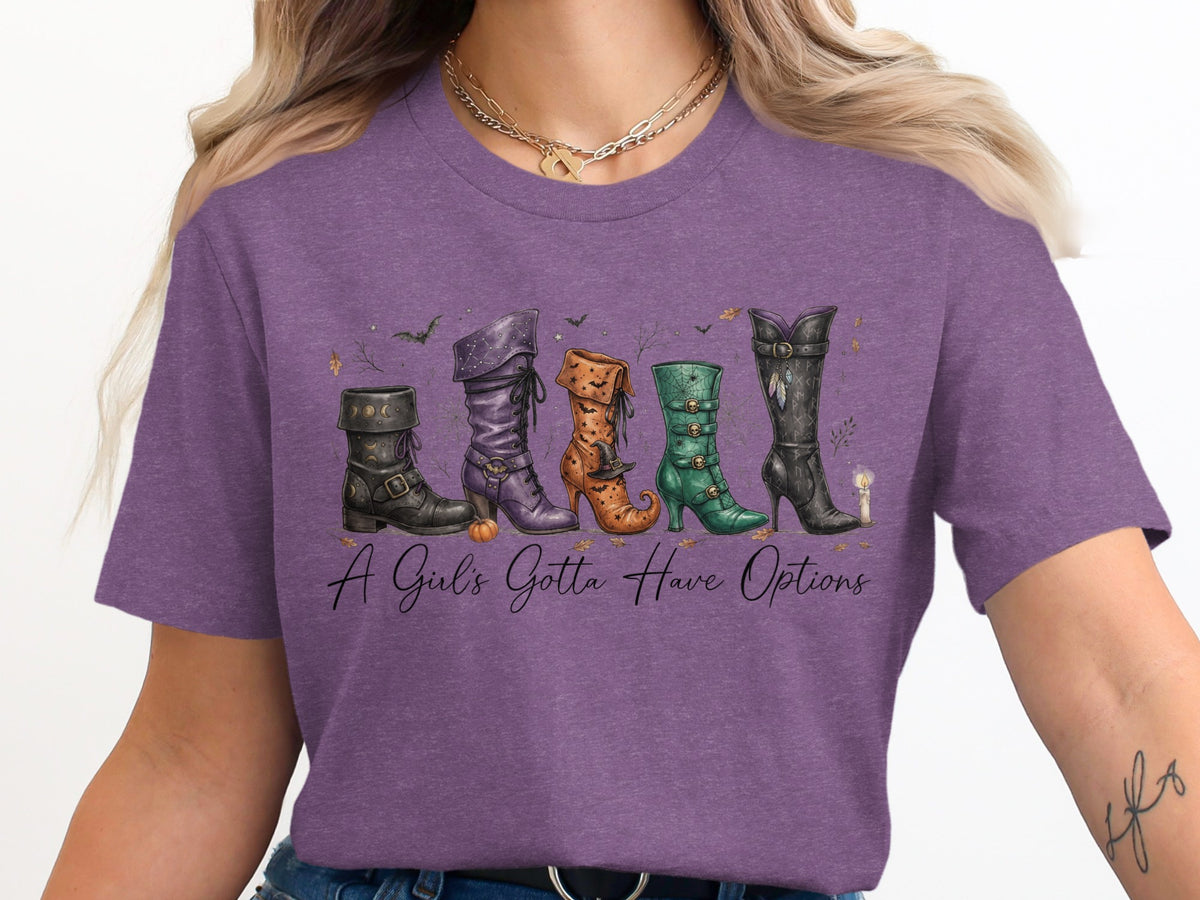 Five witch boots with text "A Girl's Gotta Have Options" on a purple shirt.
