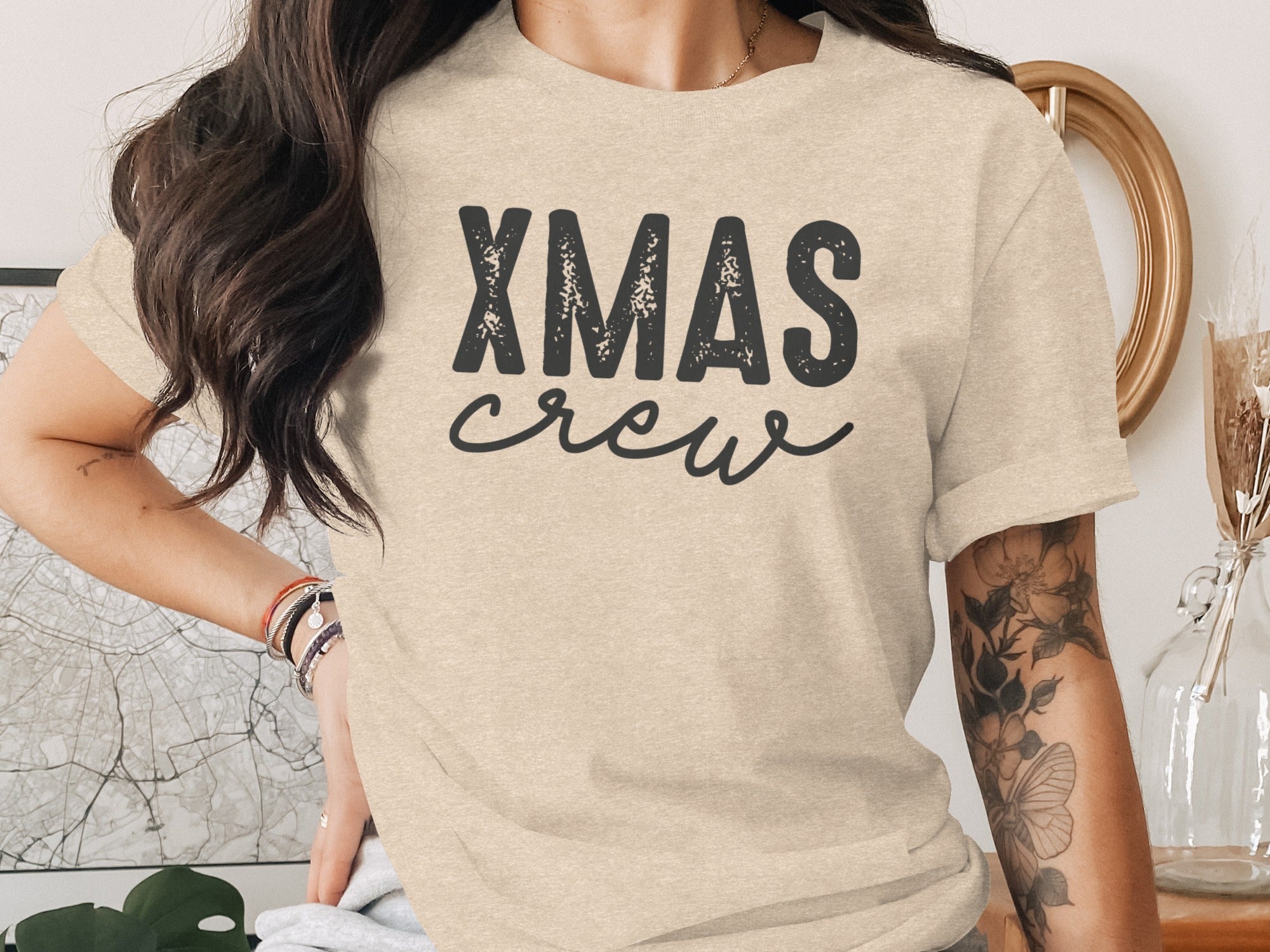 Beige t-shirt with black "XMAS crew" graphic print on the front.
