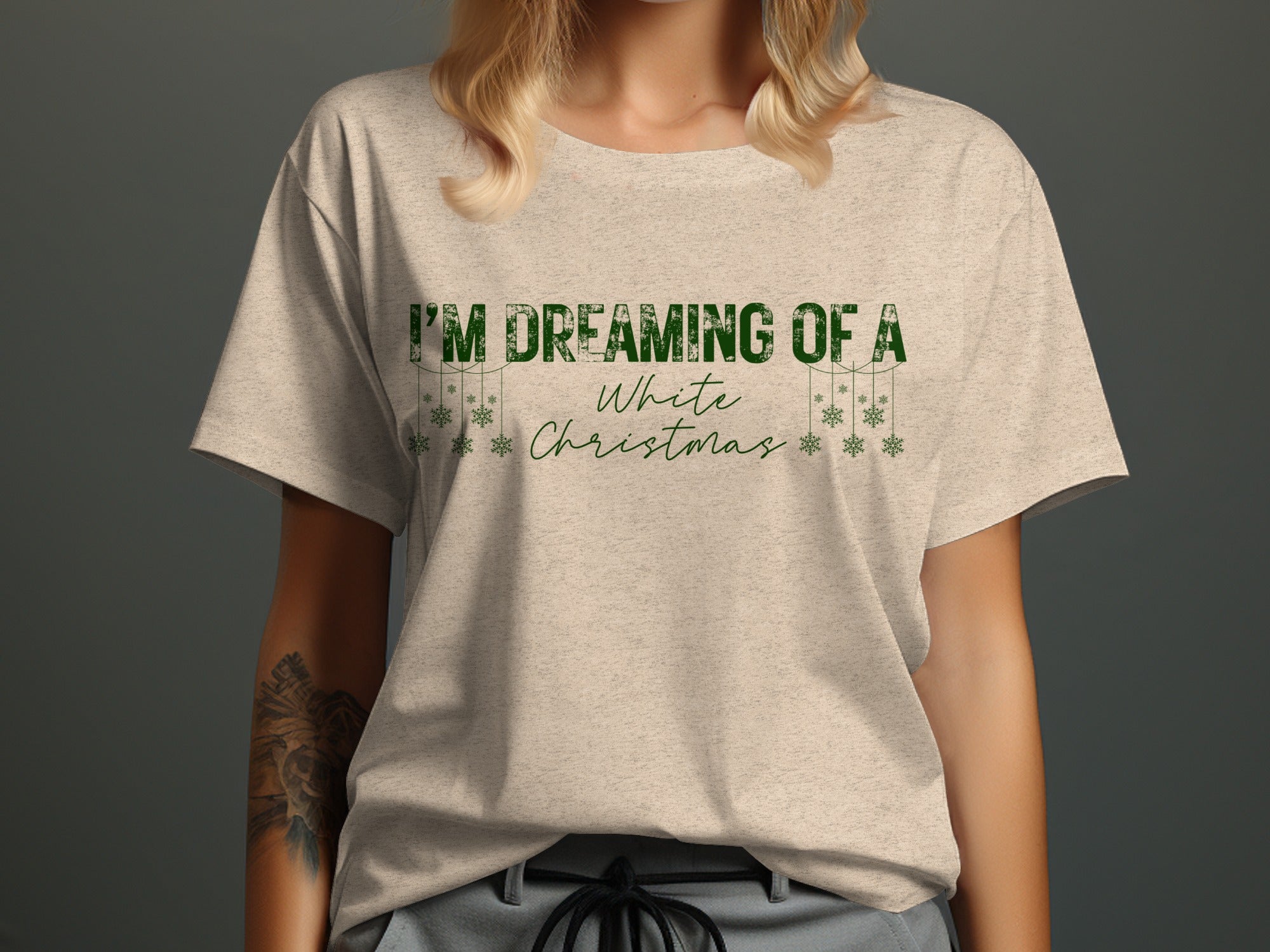 Light tan t-shirt with green text "I'M DREAMING OF A White Christmas" and snowflakes.