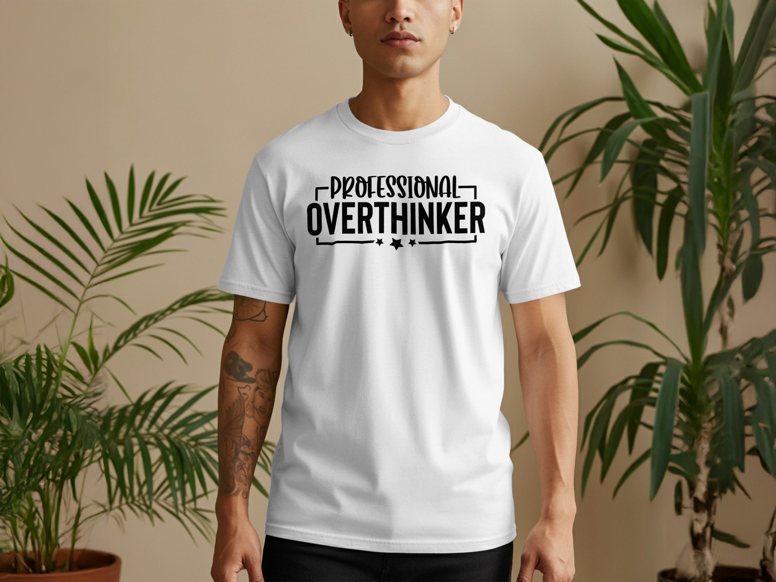 White t-shirt with black text reading "PROFESSIONAL OVERTHINKER" and stars.