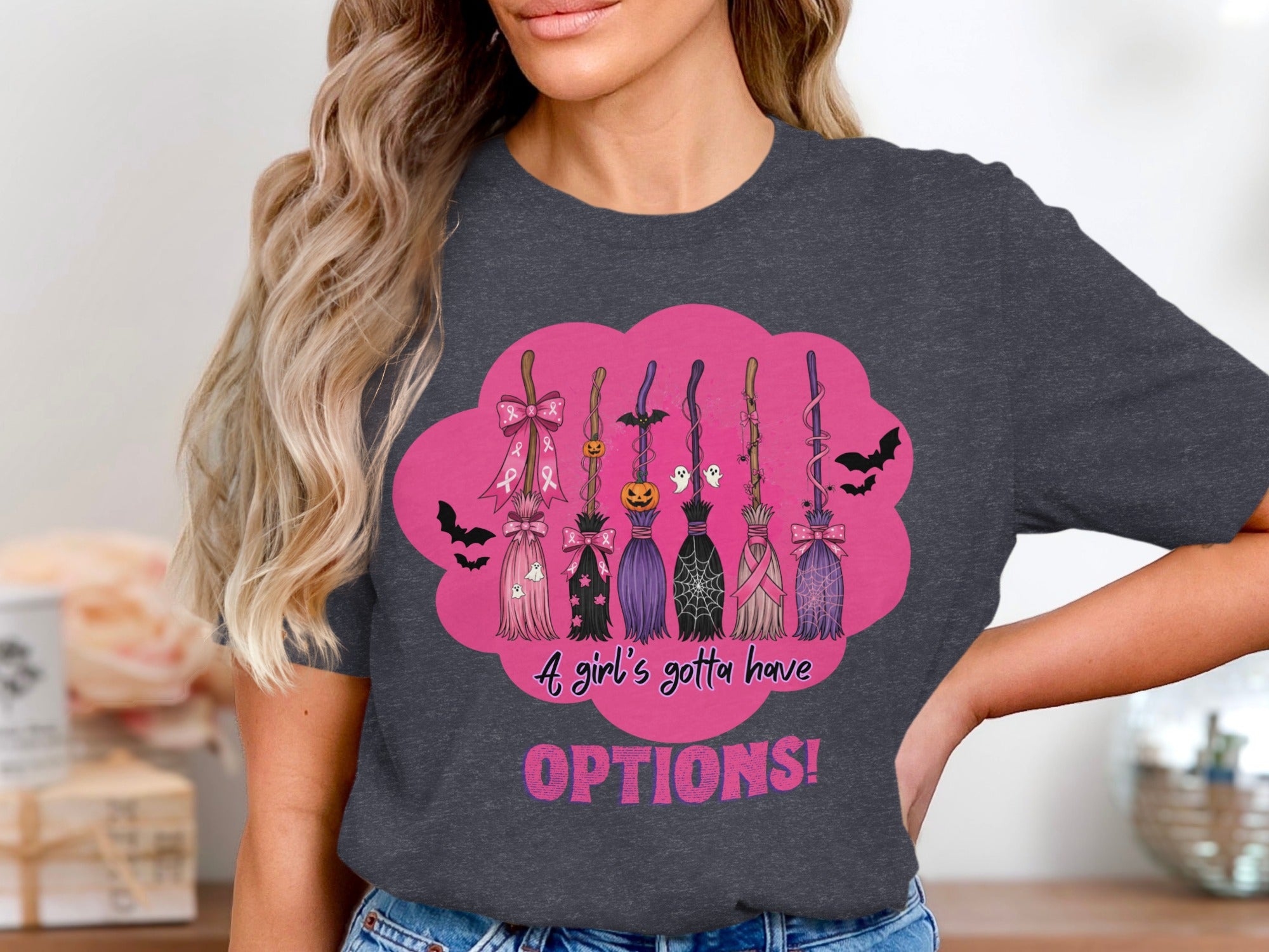 Witches' brooms with Halloween and breast cancer ribbon designs, text "A girl's gotta have OPTIONS!".