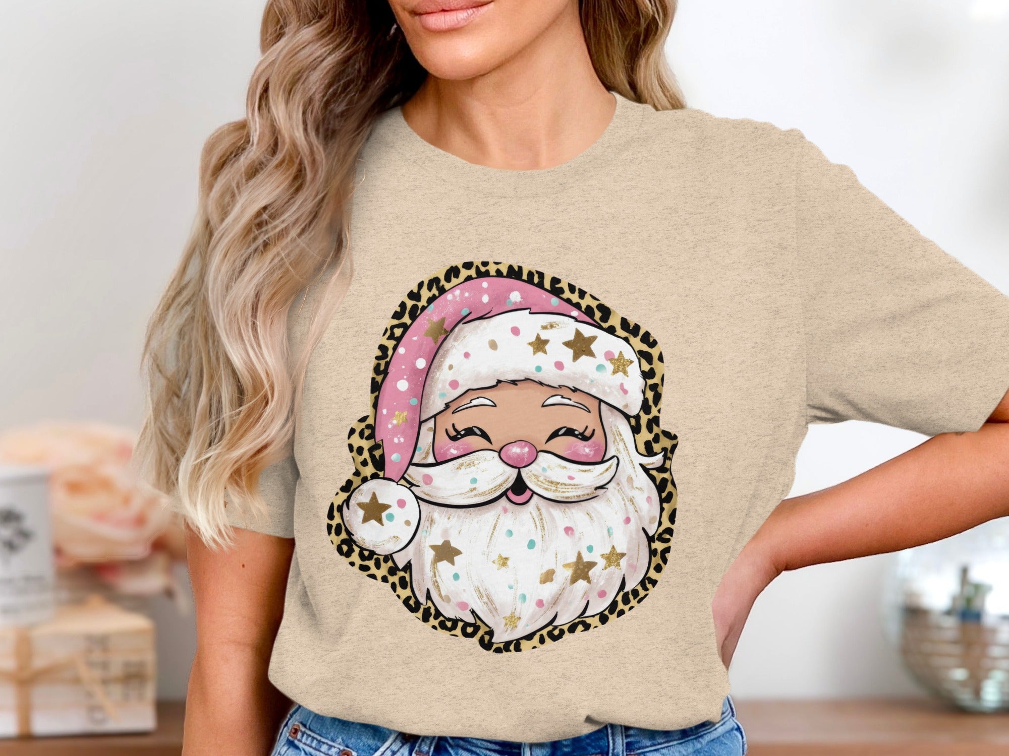 Santa Claus graphic with leopard print border on a tan t-shirt.
