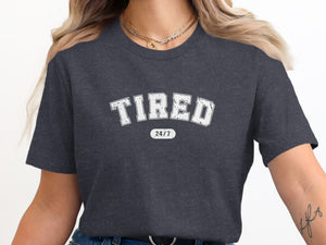 Dark grey t-shirt with white "TIRED 24/7" text.