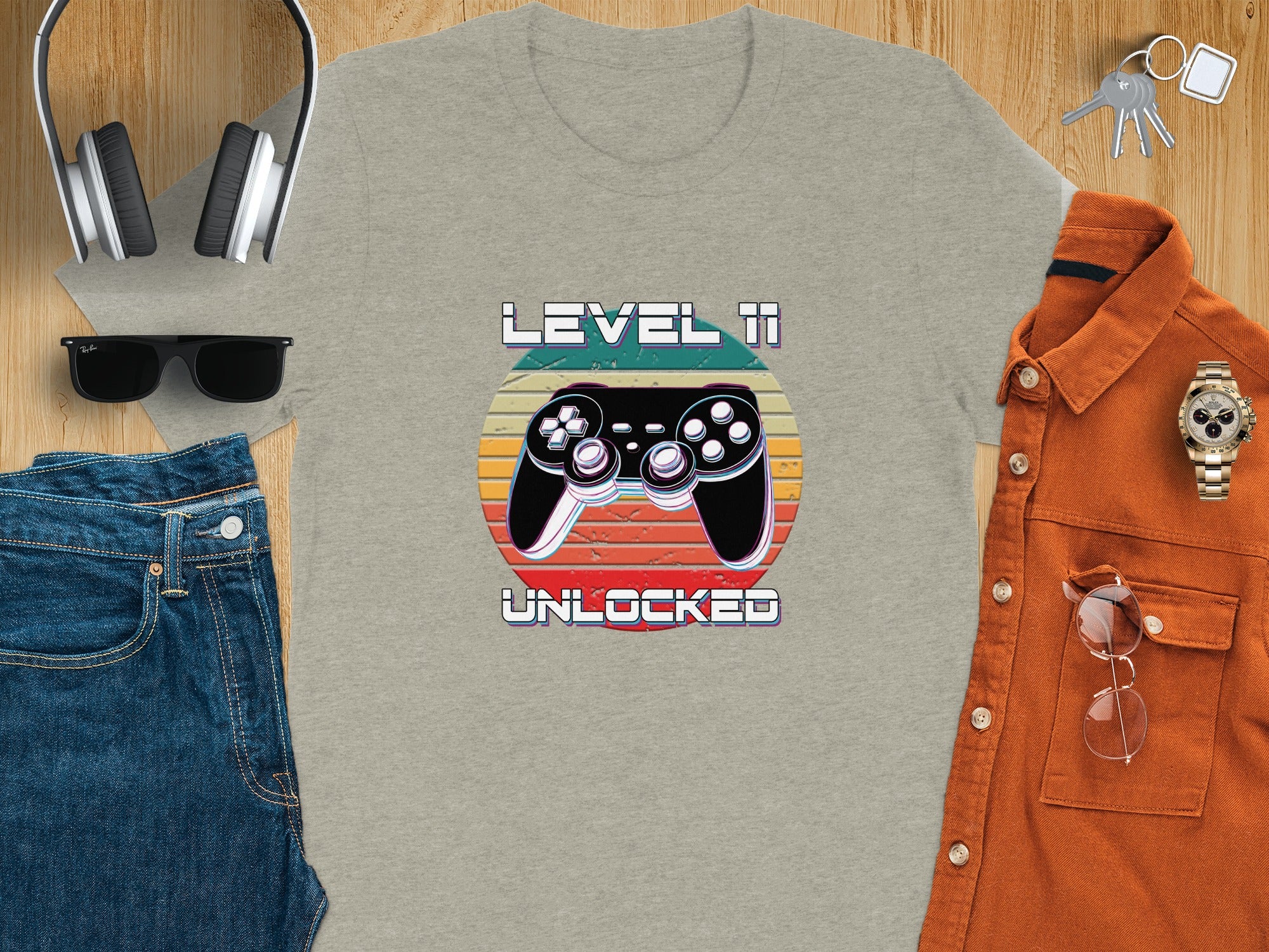 T-shirt with "Level 11 Unlocked" text and retro video game controller graphic.