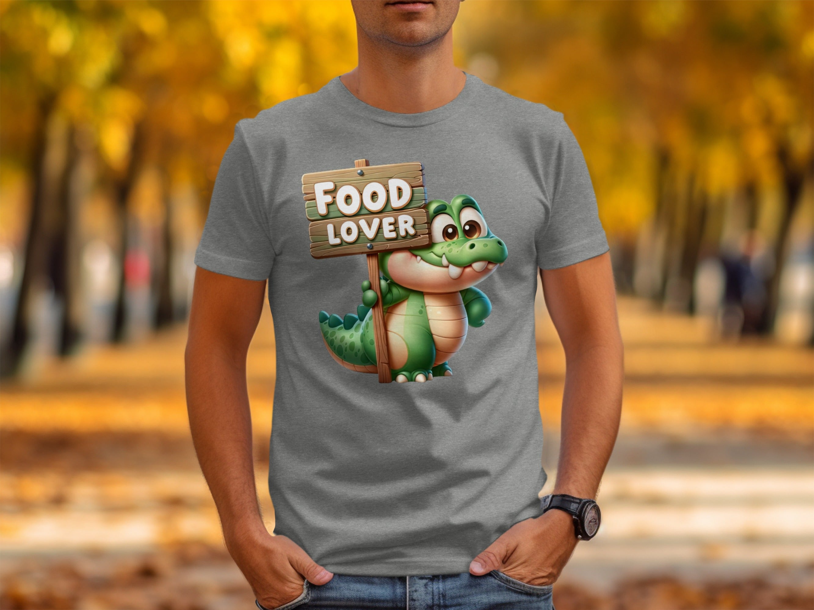 Grey t-shirt with cartoon alligator holding a "Food Lover" sign