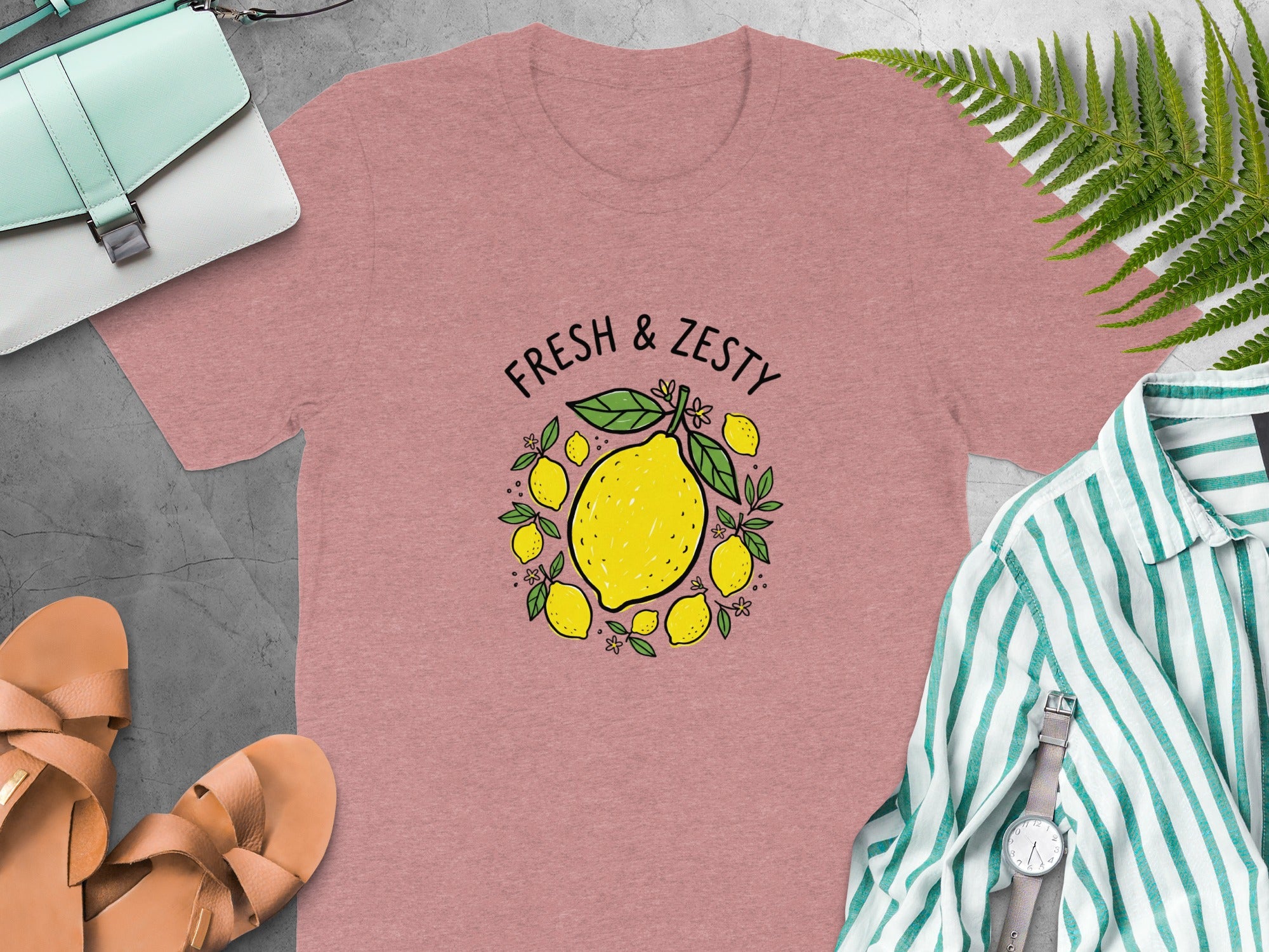 Pink t-shirt with "FRESH & ZESTY" text and lemon graphic.