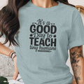 Light blue t-shirt with "It's a GOOD Day to TEACH tiny humans" graphic.