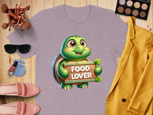 Purple t-shirt with a cartoon turtle holding a "Food Lover" sign.