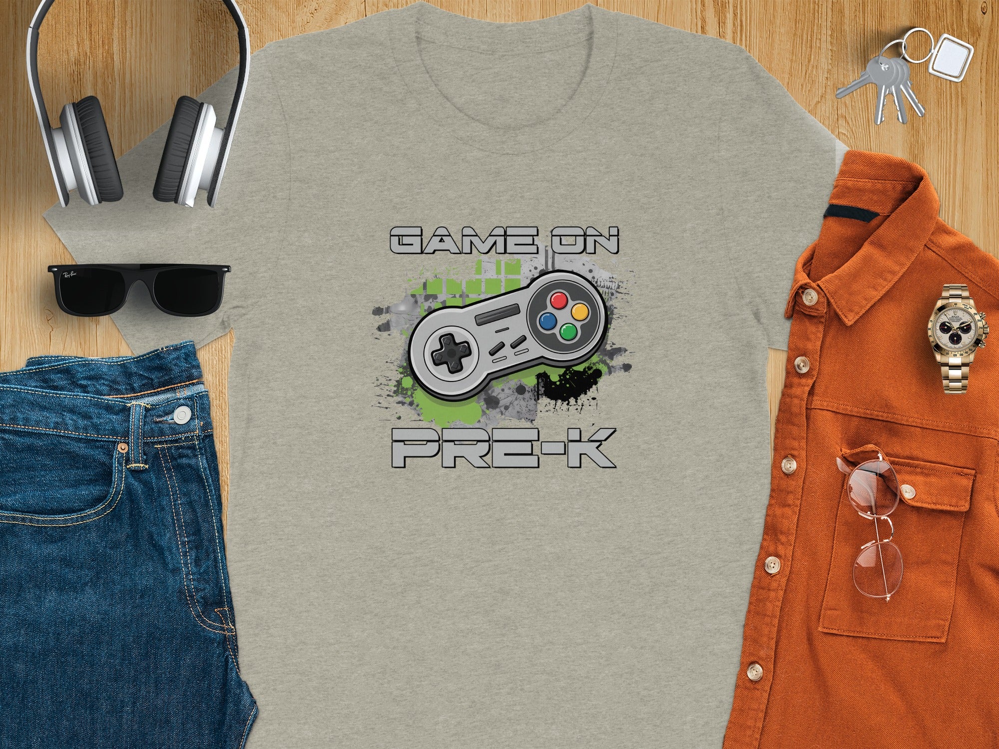 Grey t-shirt with "GAME ON PRE-K" text and video game controller graphic.