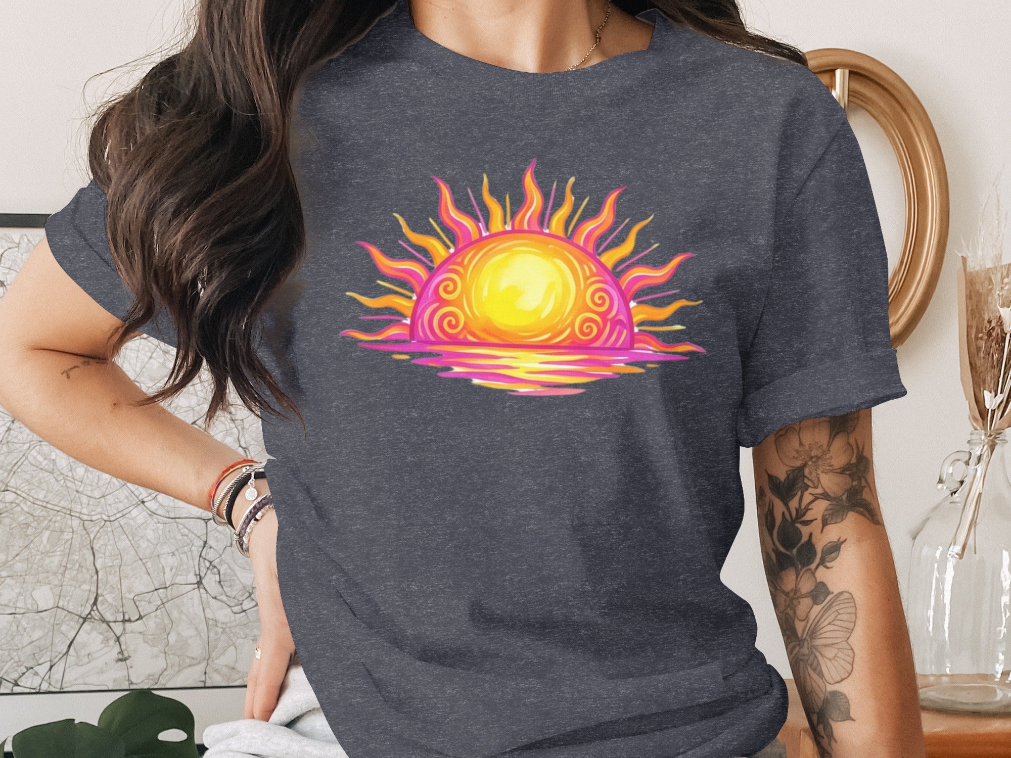 Dark gray t-shirt with a graphic of a colorful sun setting over water.